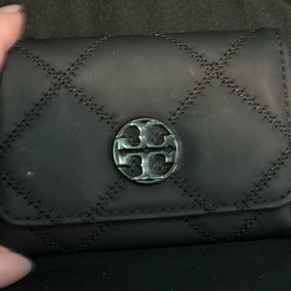 Black leather Tory Burch wallet with black plastic hardware